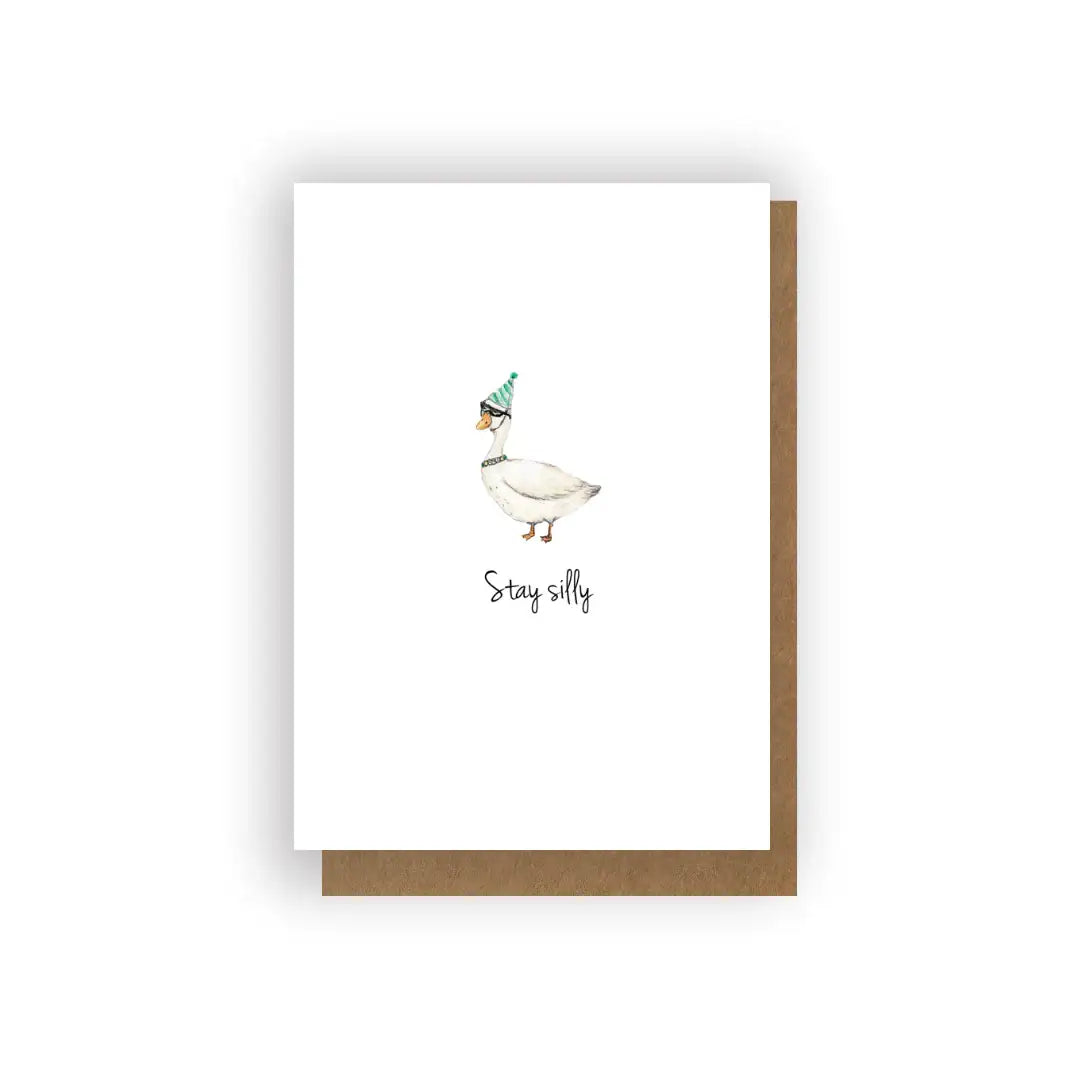 Handcrafted greeting card with a goose in a party hat and 'Stay silly' text